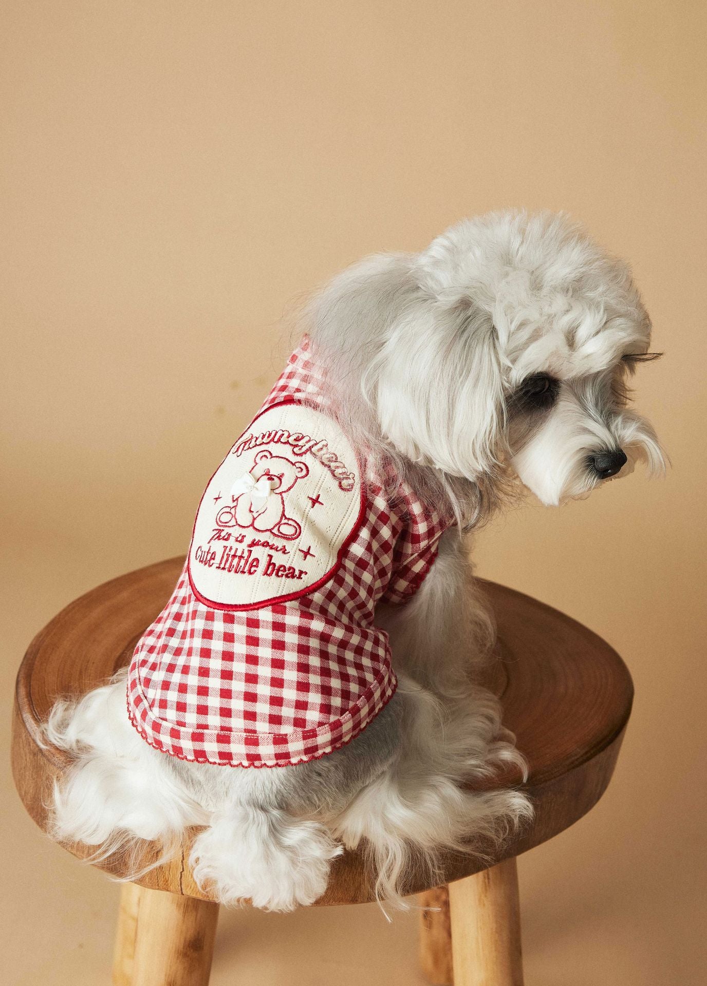 a red plaid sleeveless vest