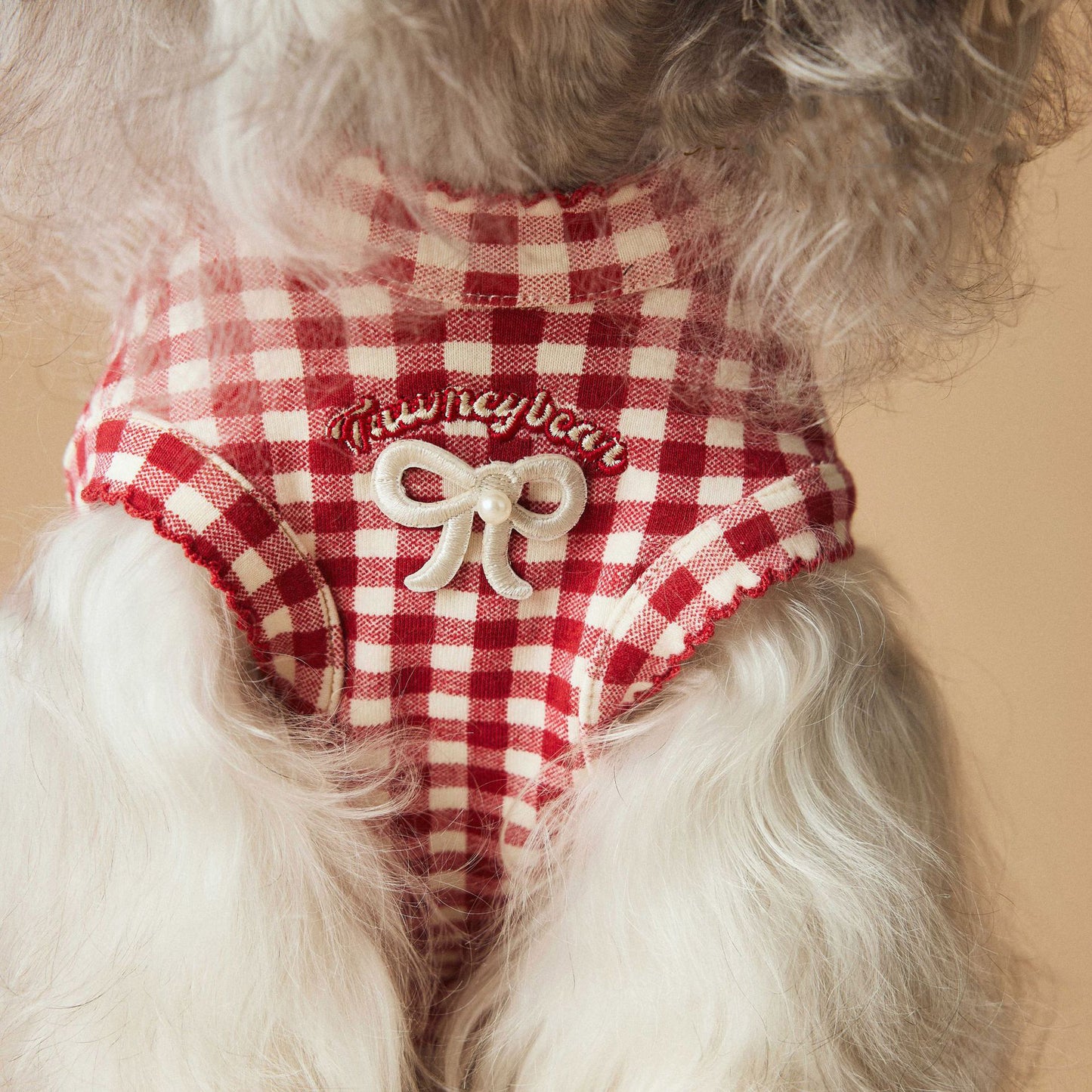a red plaid sleeveless vest