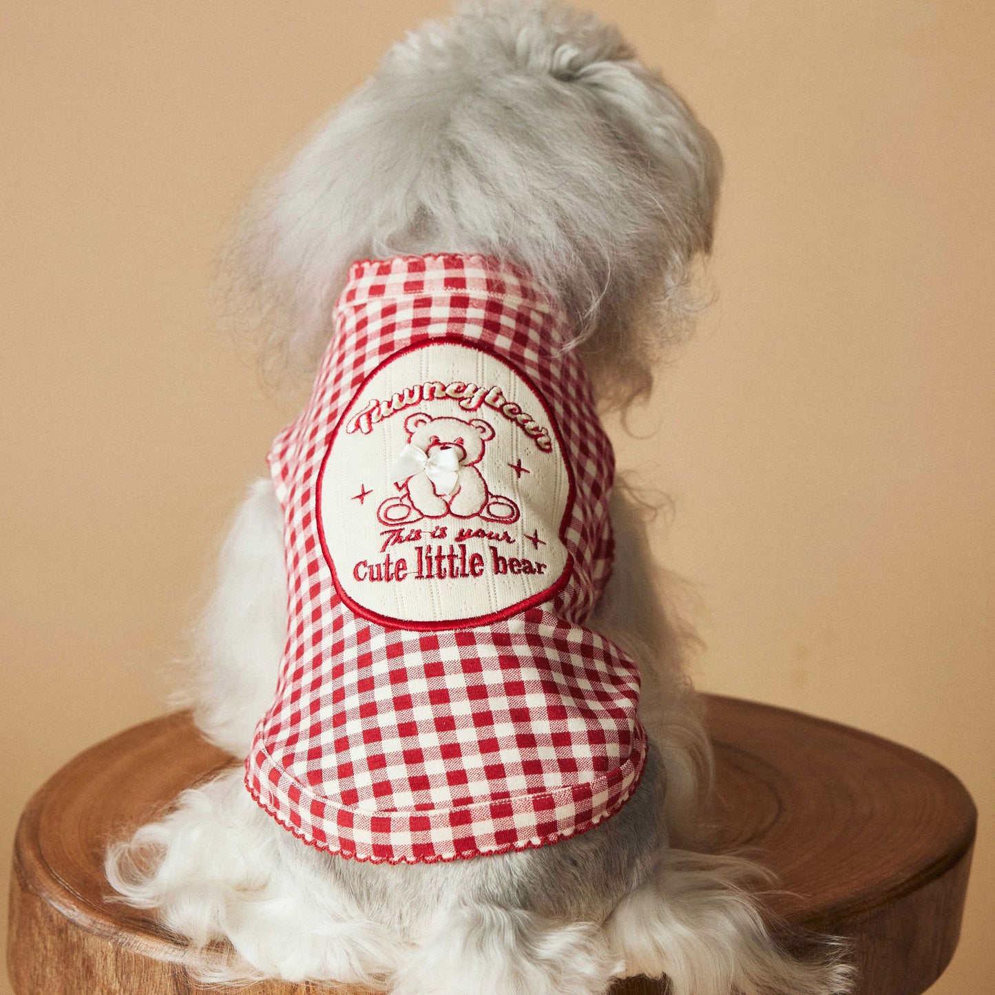 a red plaid sleeveless vest