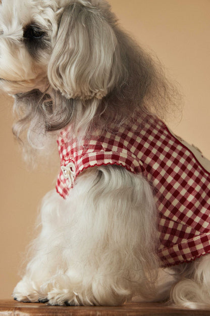 a red plaid sleeveless vest