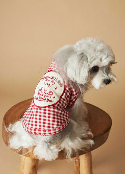 a red plaid sleeveless vest
