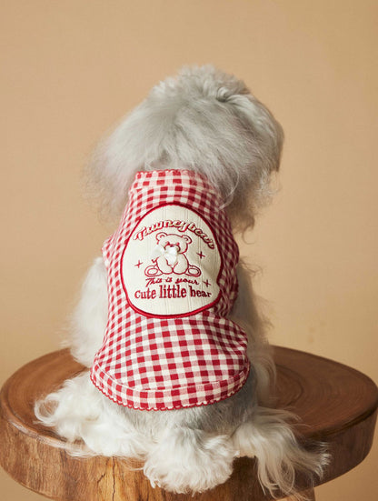 a red plaid sleeveless vest