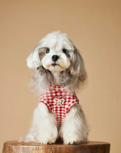 a red plaid sleeveless vest