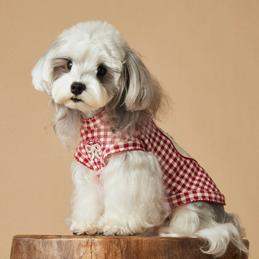 a red plaid sleeveless vest