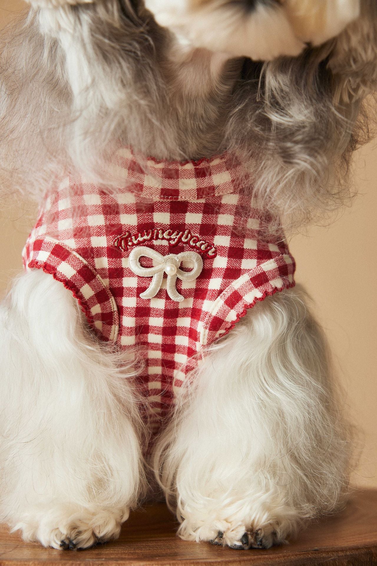 a red plaid sleeveless vest