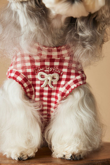 a red plaid sleeveless vest