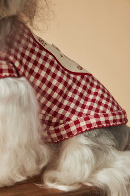 a red plaid sleeveless vest